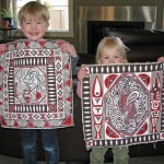 Rafe and Alexa show off their paintings